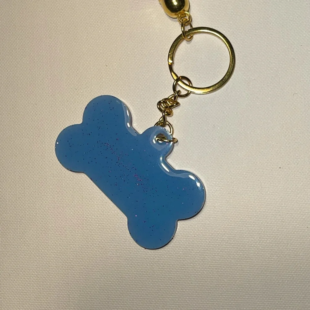 Dog-bone resin glitter‎ keychain with tassel